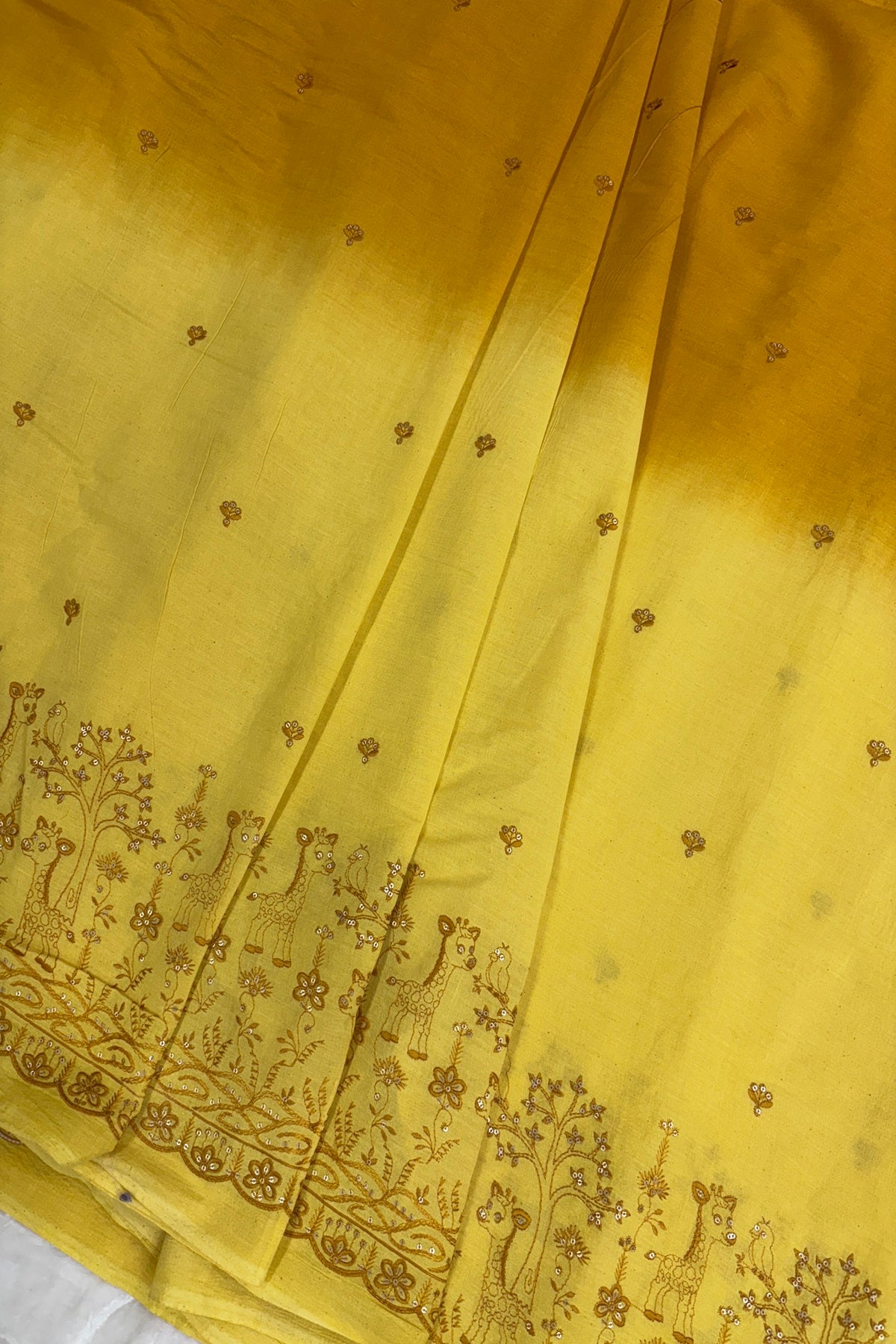 Hues Of Yellow Jungle Theme Embroiderey With Scallop Border Highligted With Sequins Kora Cotton Fabric