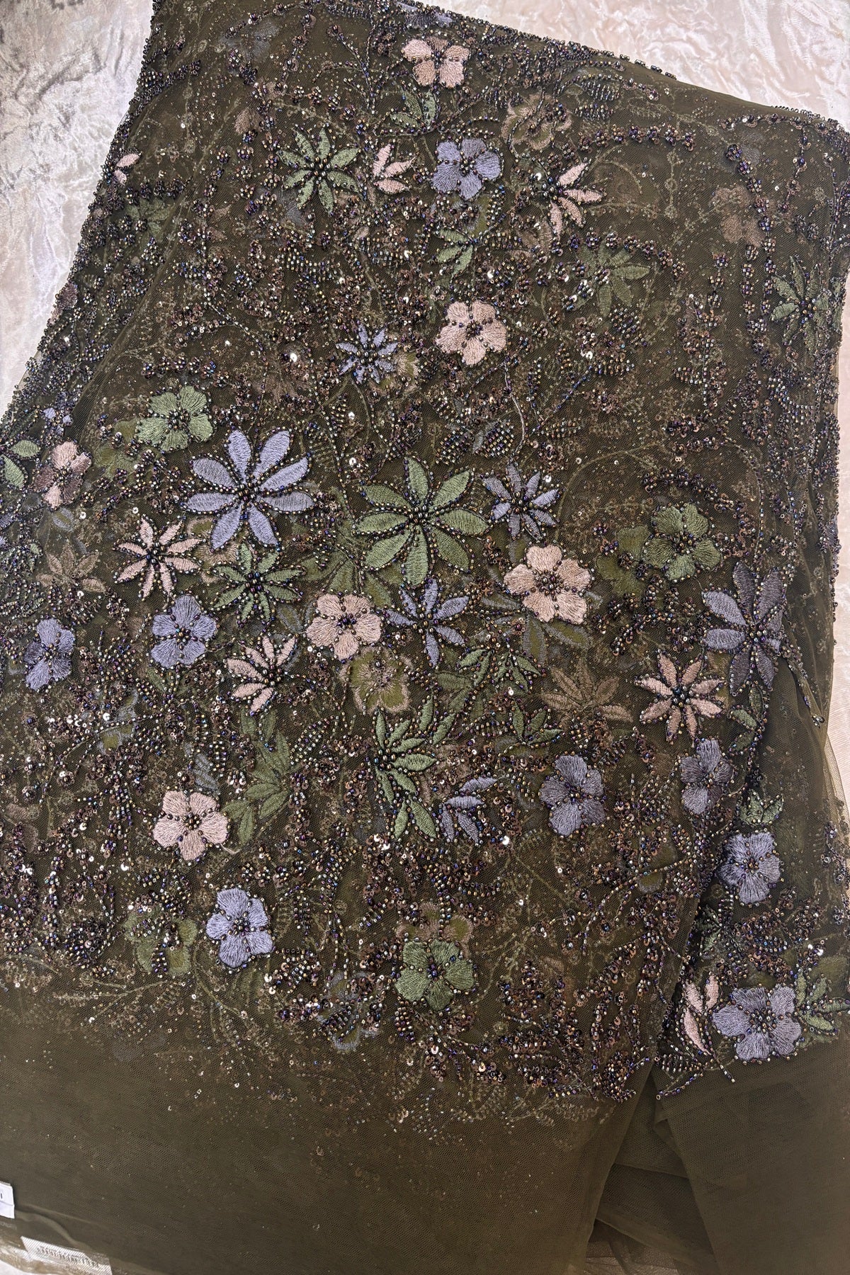 Olive Green,Blue Grey & Mauve Floral Embroidery Highlighted With Black Rainbow Cutbeads & Sequins Net Fabric