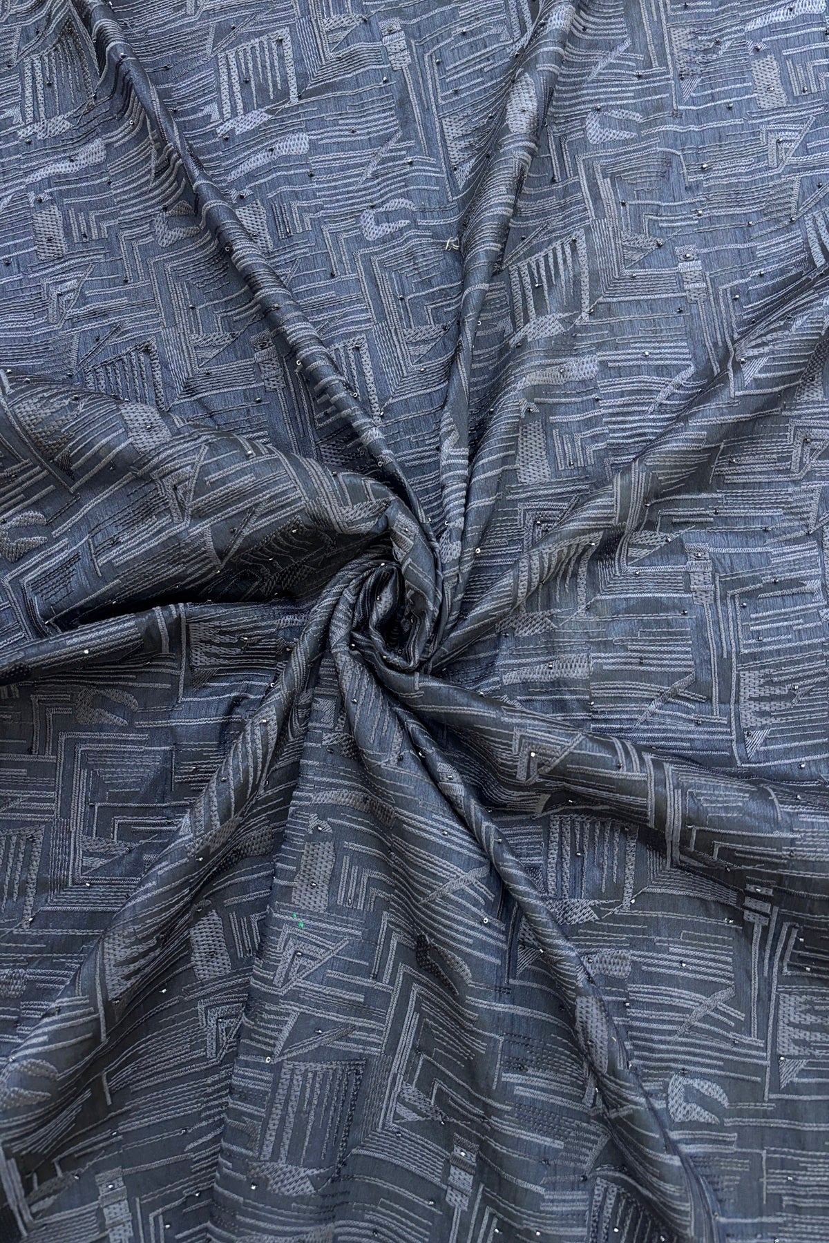 Geometrical Patterns Self Thread Embroidered Semi Raw Silk Fabric