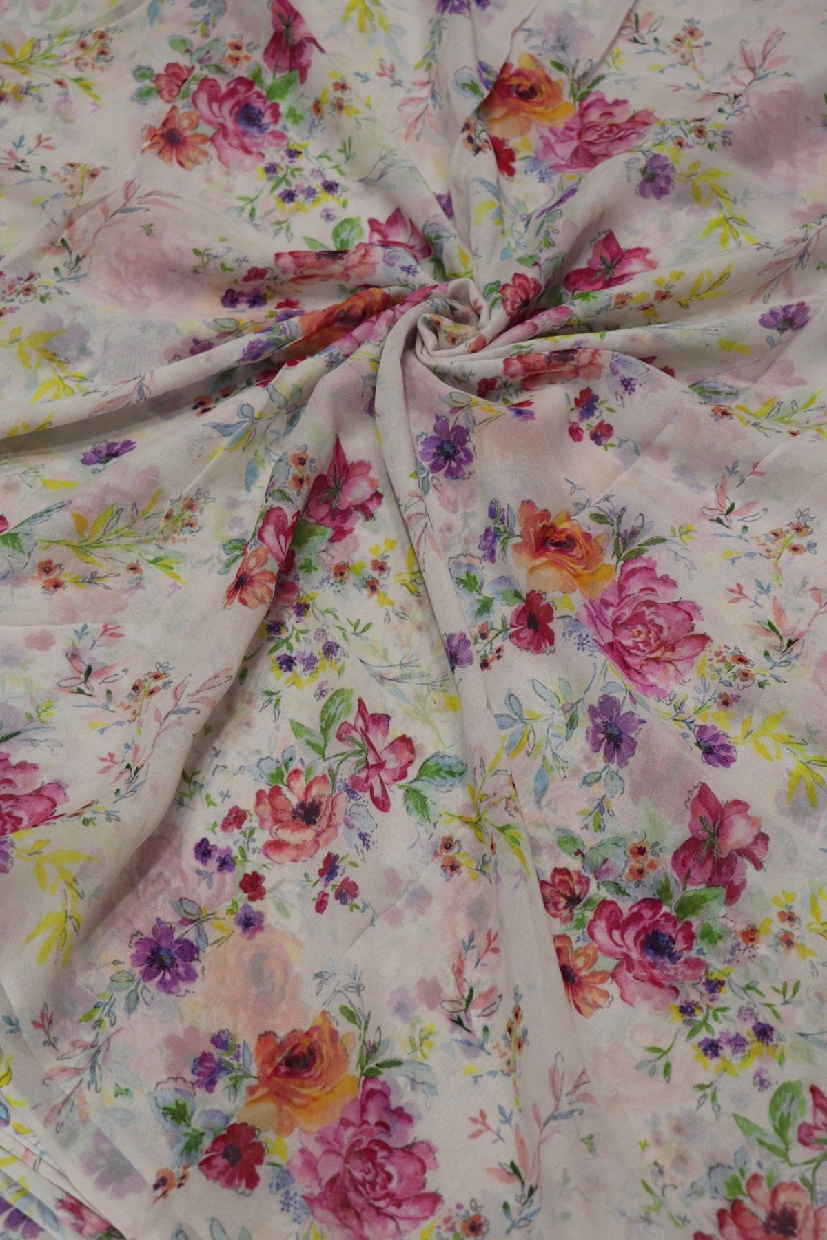White Printed Georgette Fabric With Hues Of Pink & Oran0ge Flowers