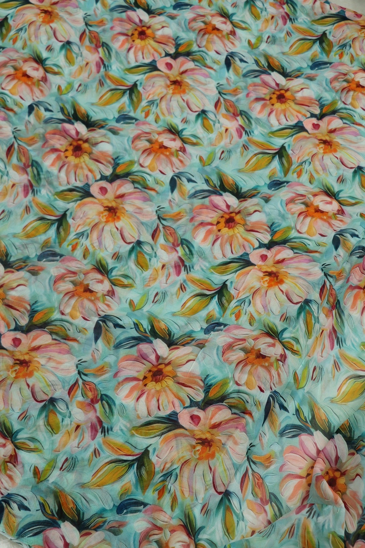 Celeste Blue With Peach & Sunset Yellow Floral Printed Georgette Fabric