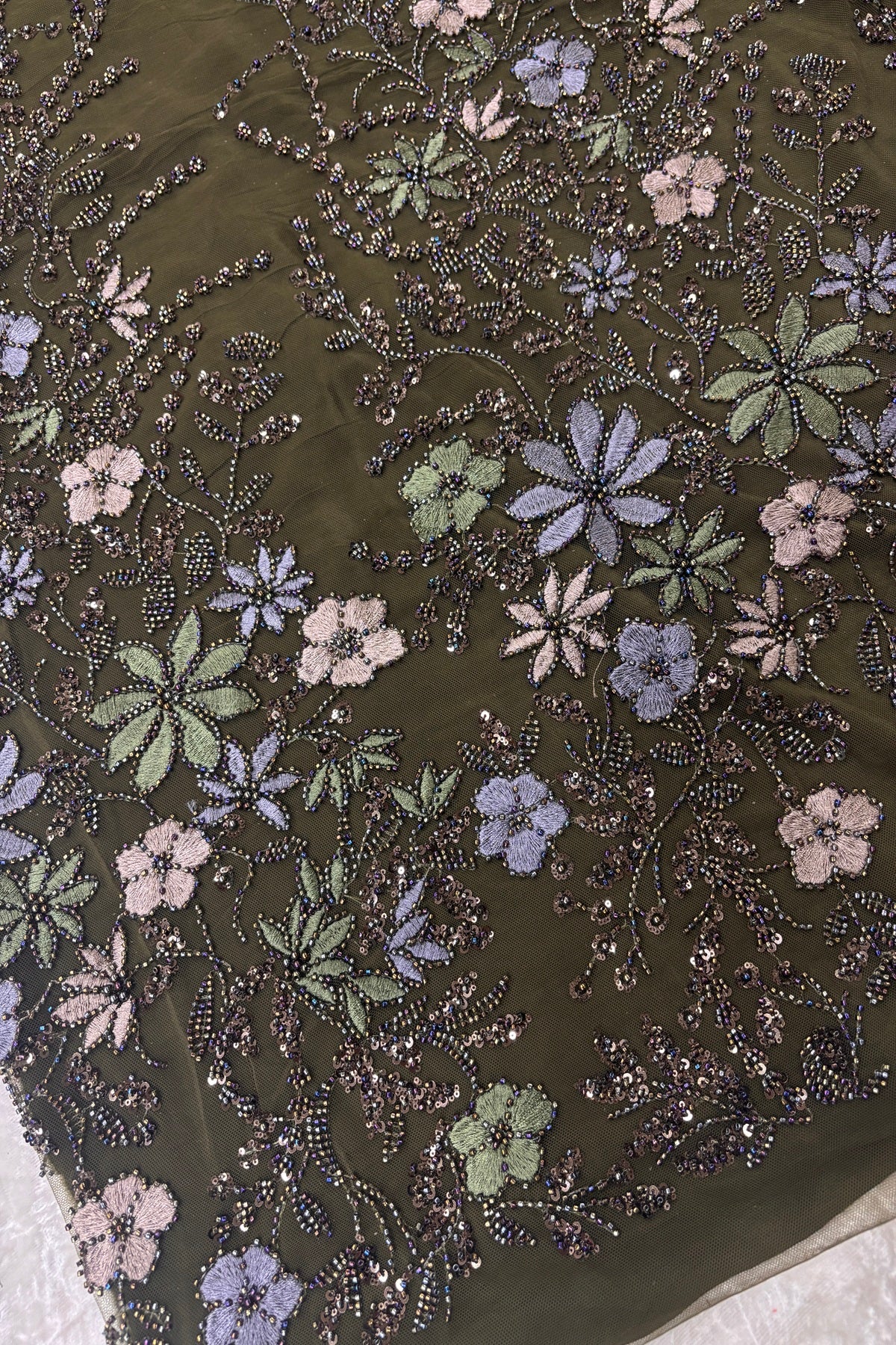 Olive Green,Blue Grey & Mauve Floral Embroidery Highlighted With Black Rainbow Cutbeads & Sequins Net Fabric