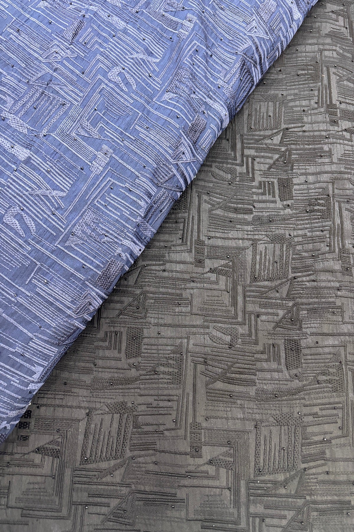 Geometrical Patterns Self Thread Embroidered Semi Raw Silk Fabric