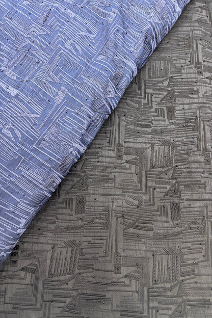 Geometrical Patterns Self Thread Embroidered Semi Raw Silk Fabric