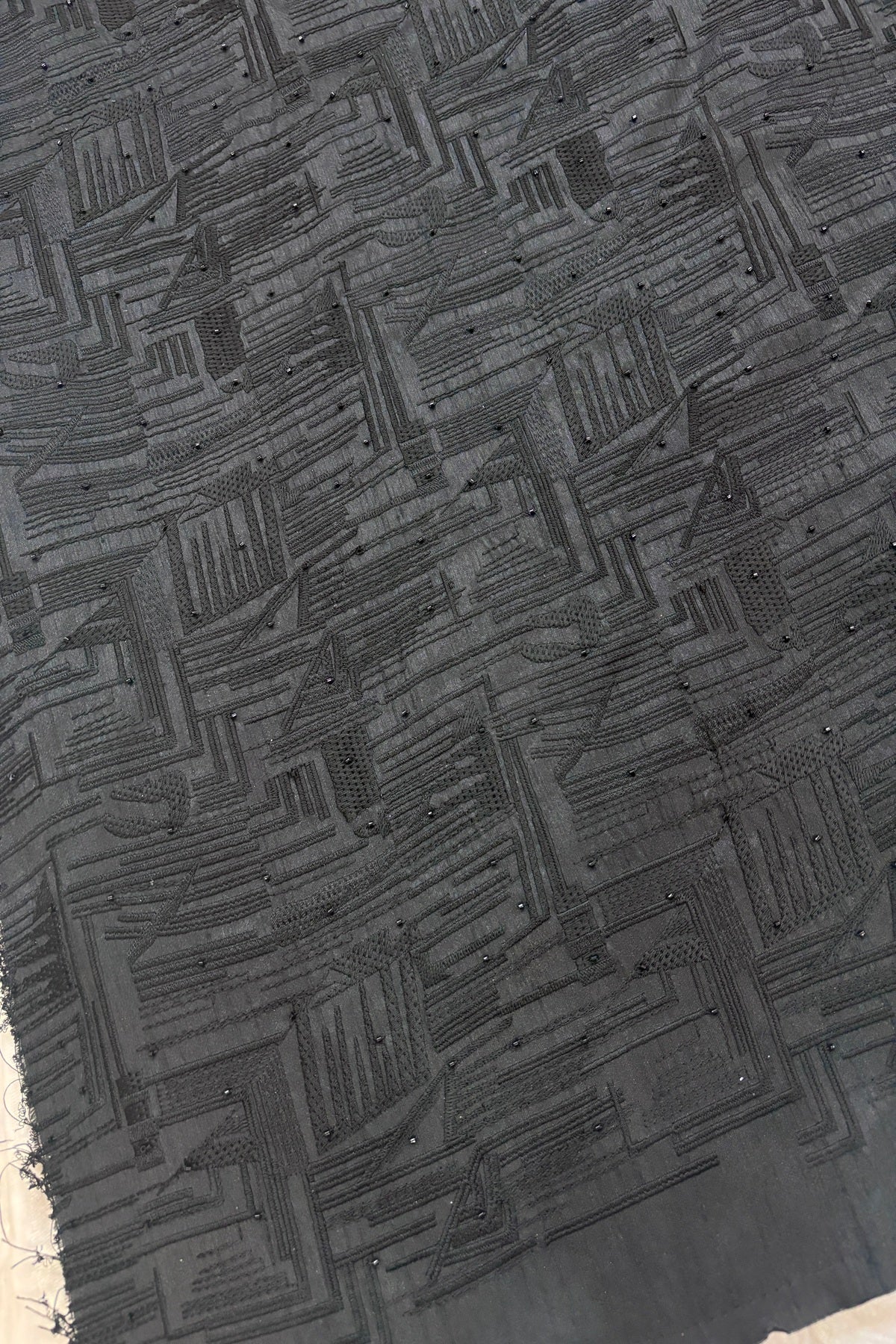 Geometrical Patterns Self Thread Embroidered Semi Raw Silk Fabric