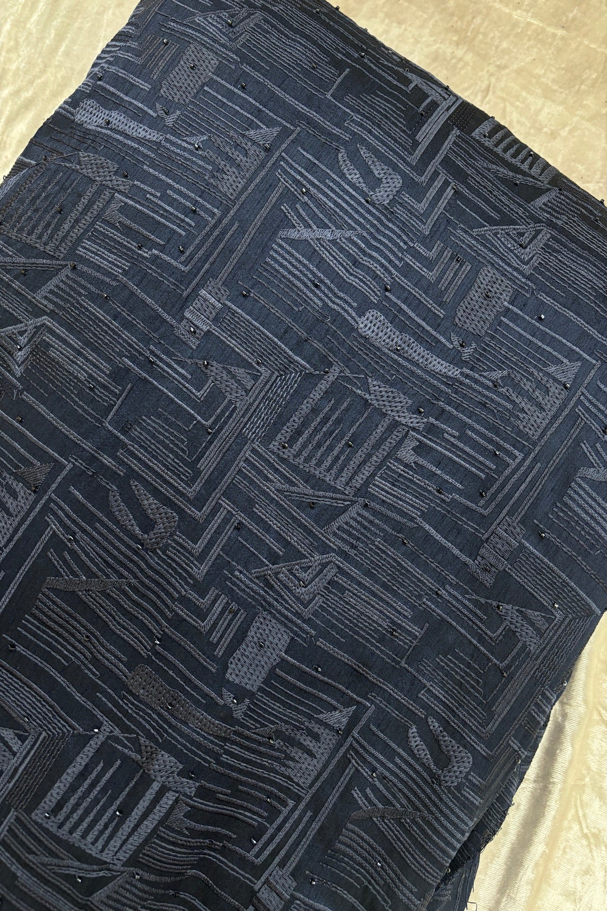 Geometrical Patterns Self Thread Embroidered Semi Raw Silk Fabric