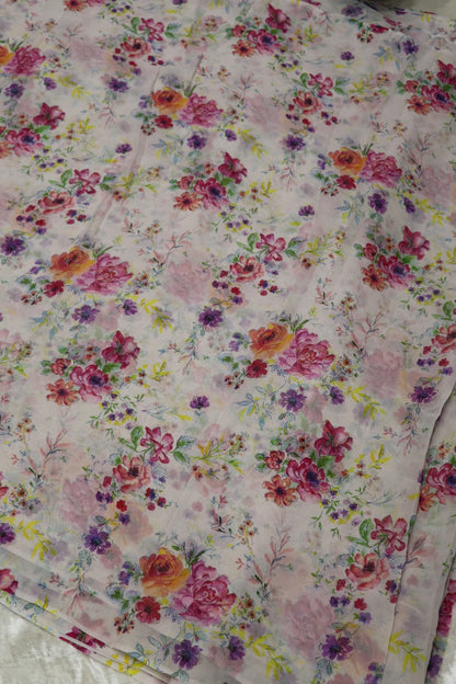White Printed Georgette Fabric With Hues Of Pink & Oran0ge Flowers