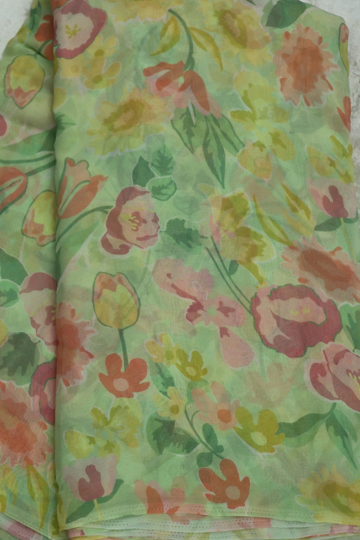 Spring Green With Hues of Peach Pinks Floral Printed Georgette Fabric