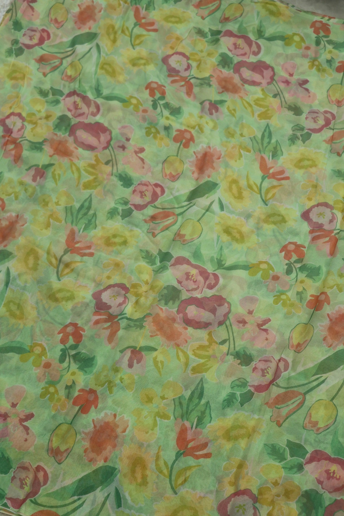 Spring Green With Hues of Peach Pinks Floral Printed Georgette Fabric
